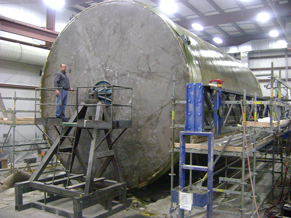 30 - Foot Diameter fiberglass (FRP) tank on filament winder, bottom wound on to the vertical wall of the tank